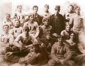 Black & white image illustrating 17 American football players in their uniforms with both a single "A" and "UA" visible.