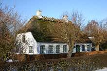 photograph of a thatched country cottage