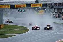 Fernando Alonso attempting to overtake Vettel at the start of the race.