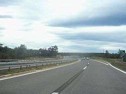 A view of dual carriage motorway following a curve