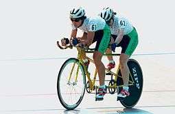 tandem bicyclists on track