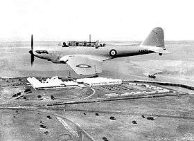 Single-engined three-seat military monoplane in flight, side-on