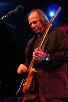 Adrian Belew plays electric guitar