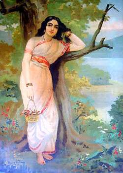 A painting of a young fair woman clad in a white sari with a red border stands, leaning on a tree, as she moves her left hand through her long black hair and holds a flower basket in her outstretched right hand.