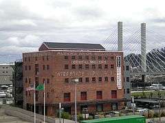 Photograph of a five-story, brick industrial building.