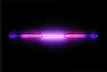 Vial containing a violet glowing gas