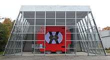 The metal red chassis of the ARGUS detector exposed in a dedicated glass hall