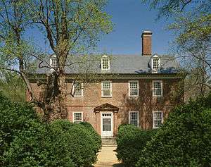 Photo of a three-story brick house