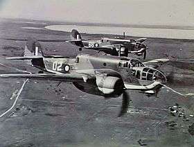 Two twin-engined military aircraft in flight