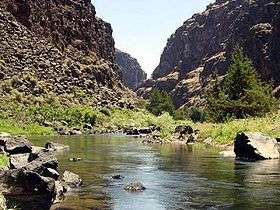 A small river flowing through a rocky canyon