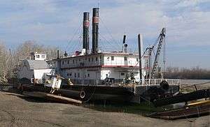 A photograph of a sidewheel dredge