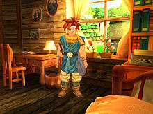 Horizontal rectangular video game screenshot that is a digital representation of a room in a house. A character with red spiked hair stands in the center of the image.