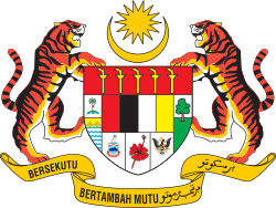 Shield showing symbols of the Malaysian states with a star and crescent above it and a motto below it supported by two tigers