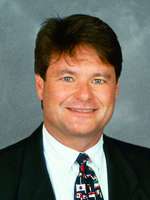 Head and shoulders of a Caucasian man wearing a suit