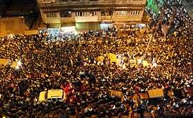 People outside Hazarika's home on 7 November 2011