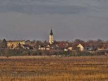 In the background the Orthodox church and the primary school on the left