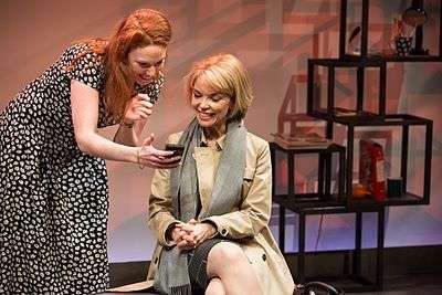 Gabrielle Scawthorn (standing) and Danielle Carter (sitting) during a performance of the play e-baby