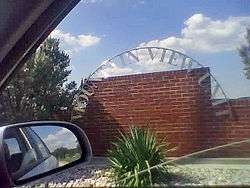 Brick wall and arch sign reading "Mountain View Unit"