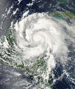 Satellite imagery depicting an intensifying hurricane in the Caribbean Sea