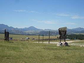 Mountains and grasslands surrounding a work center.