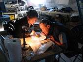 Charles Frankel and Cathrine Frandsen of Crew 3 examine rock samples in the FMARS lab on July 22, 2001.