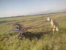 A farmer that plows on one of Calinaoan rice fields.