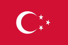 Red flag with three white crescents, each containing a five-pointed white star.