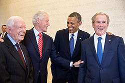 Portrait of four presidential men in dark suits and ties