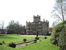 Large Jacobean three-storey house in landscaped grounds