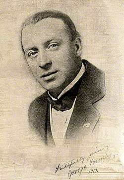 Head and shoulders, black and white picture of Formby looking towards the camera