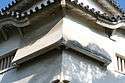 Photo of two angled chutes or "stone drop windows" on a castle structure