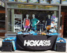 A display of Hoka One One running shoes.