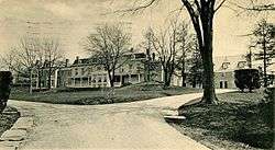 Driveway branching to three two-story buildings