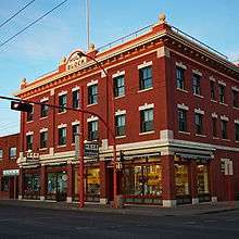 Brick commercial buildings along 97 Street.