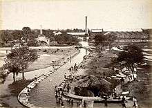 Sepia photograph of buildings around the water canal