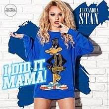 Alexandra Stan posing knowless sporting a blue duck-designed T-Shirt