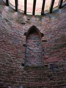 Photo of bricked-up Gothic window