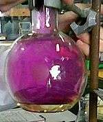 Round bottom flask filled with violet iodine vapour