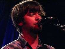 Jay Farrar singing into a microphone