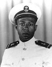 A young man in a naval uniform.