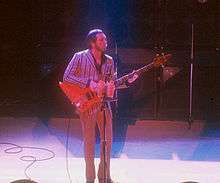 John Entwistle playing a bass guitar