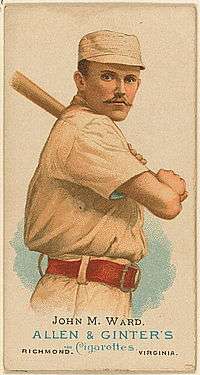 A baseball card showing a man holding a baseball bat over his left shoulder.