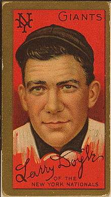 A baseball card of a man in a black and white baseball uniform.