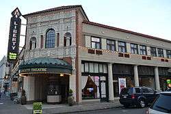 Photograph of the Astor Building, signed as Liberty Theatre.