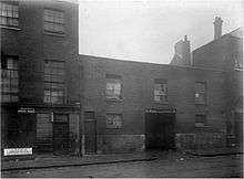 Victorian photograph of the exterior of a London slum property