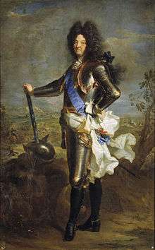 Louis XIV of France standing in plate armor and blue sash facing left holding baton