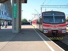 Red-and-white train at a station