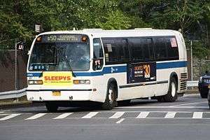 A Q50 Limited bus at an intersection in Co−Op City, Bronx.