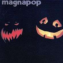 A photograph of two Jack O'Lanterns—the one to the left with jagged teeth and a furrowed brow, the other with a smile and large doe eyes—on a dark background with the word "magnapop" written in blue along the top left corner.