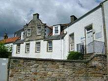 A 17th century stone house with white walls